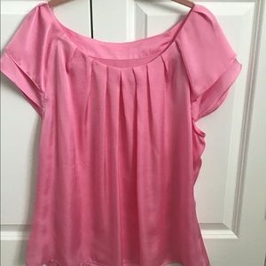 Pink polyester cap sleeved blouse. Washable.